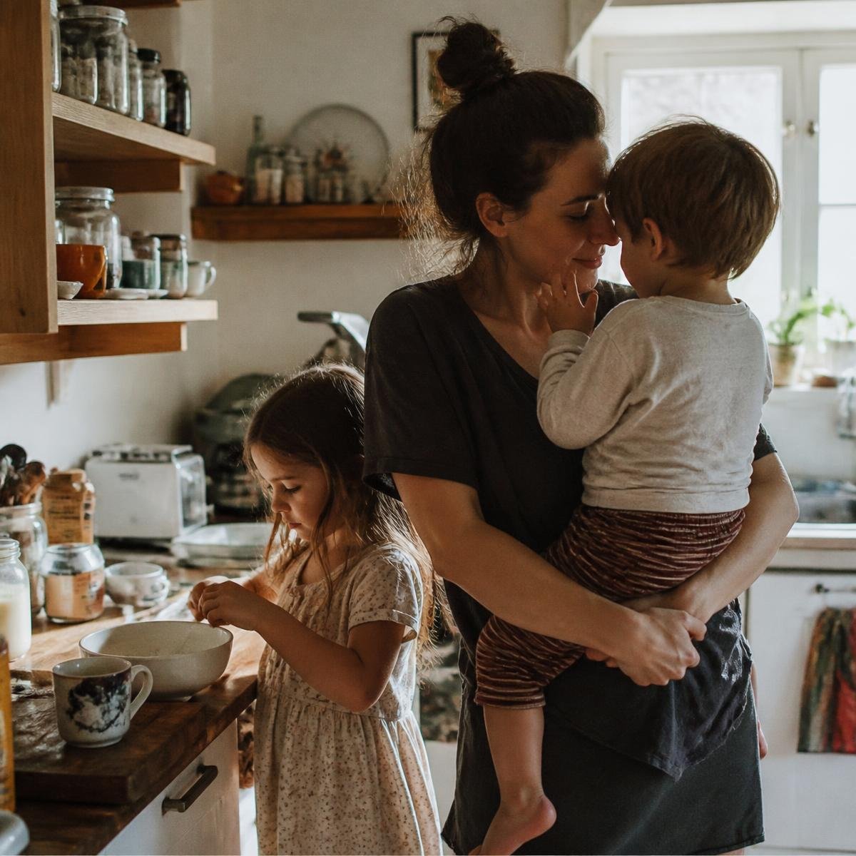 Maggie in her kitchen with two of her children